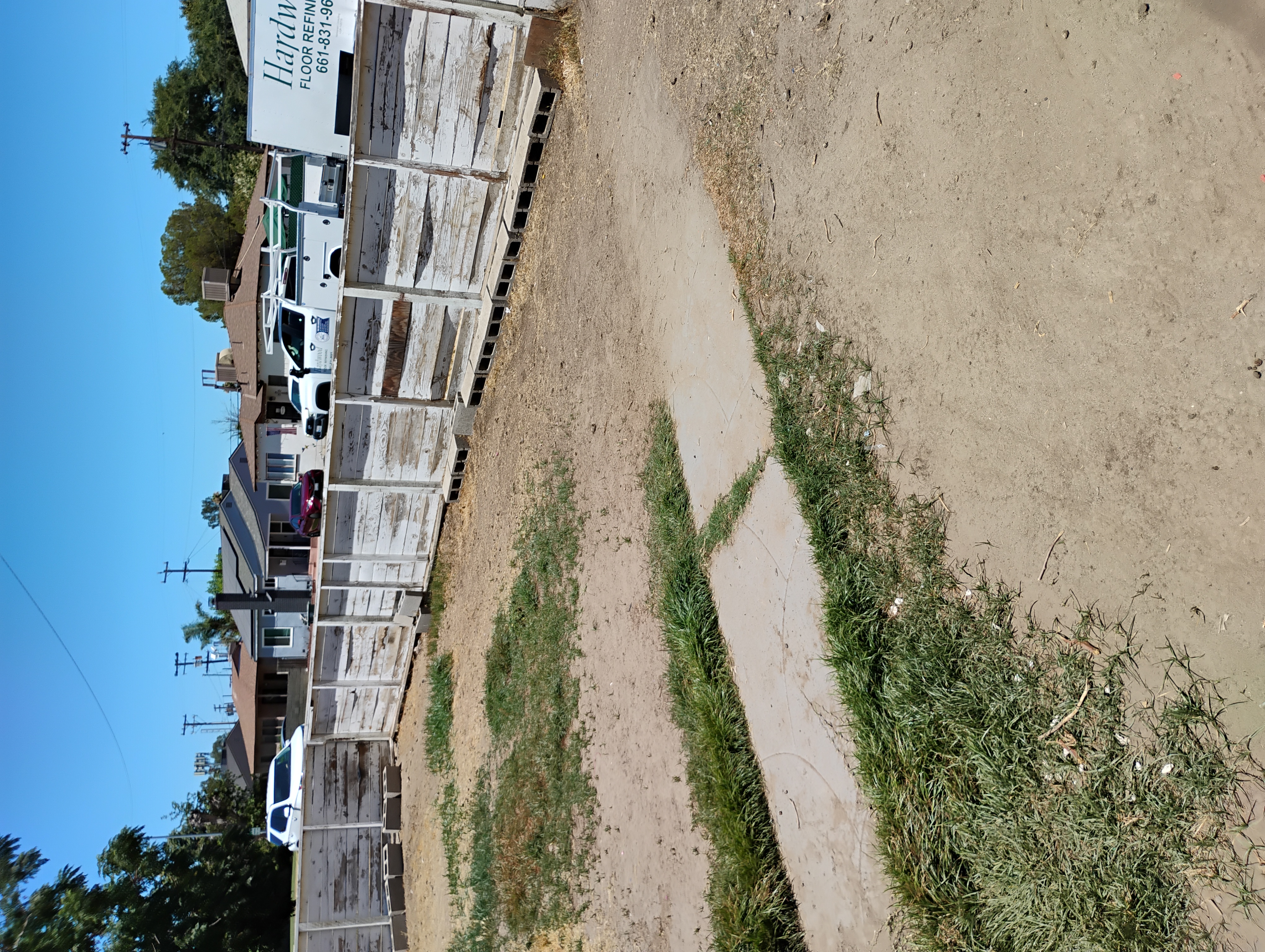 Residential property clearing: Removing old furniture and debris from a Bakersfield backyard.